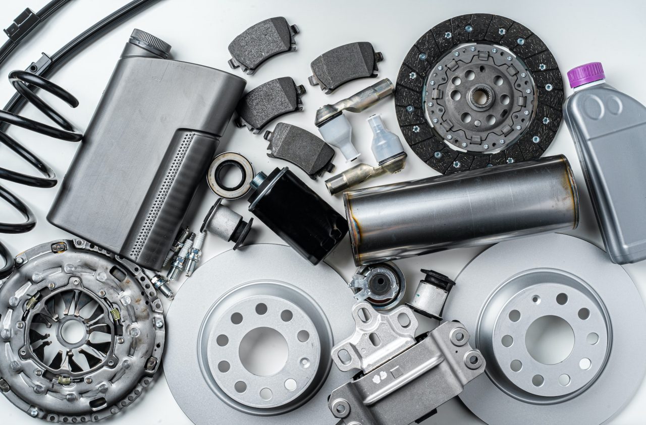 Start 25 new metal auto parts on grey background
